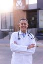 Man in White Button Up Shirt Wearing Blue and Black Stethoscope