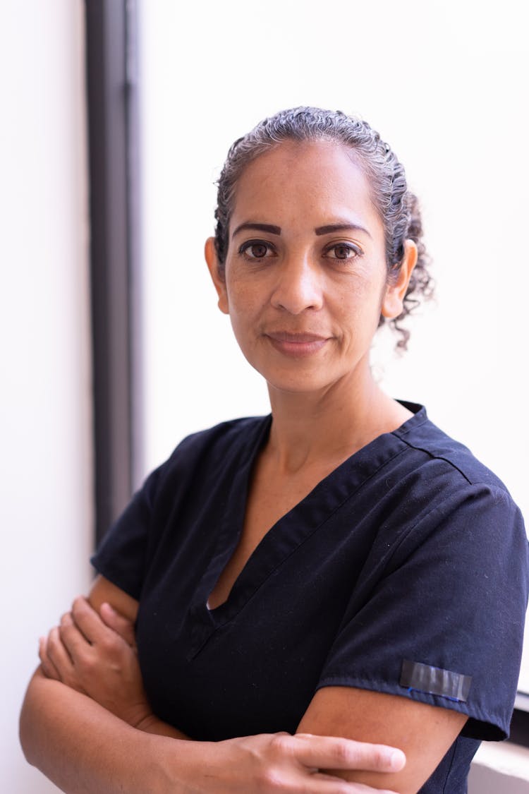 Woman Wearing Scrub Suit With Her Arms Crossed