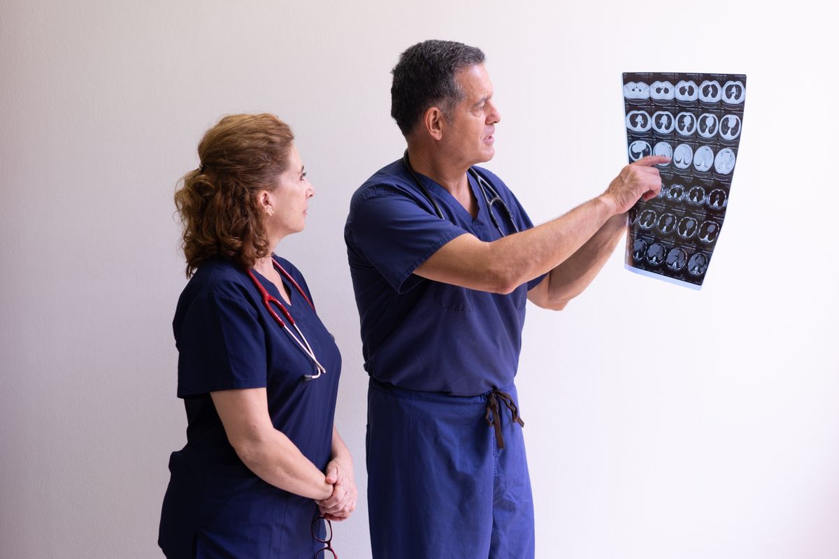 Two clinicians reviewing scans together