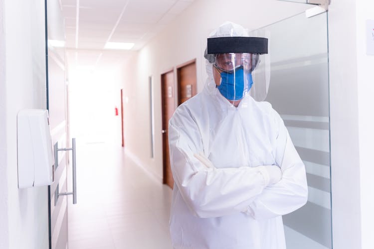 Person Wearing PPE With Arms Crossed