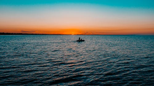 Fishermen on Boat at Sunset