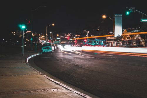 Free Capture of urban street with dynamic light trails and city traffic at night. Stock Photo
