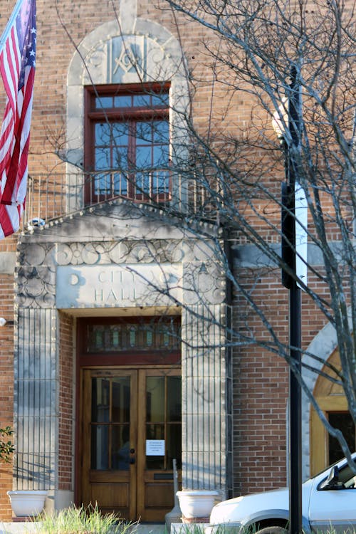 Free stock photo of american flag, city hall, doors