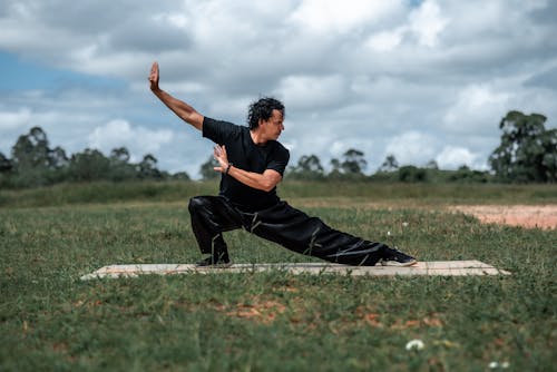 Free Man in Black Outfit Practicing Tai-chi Stock Photo