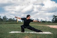 Man in Black T-shirt and Black Pants Playing Golf