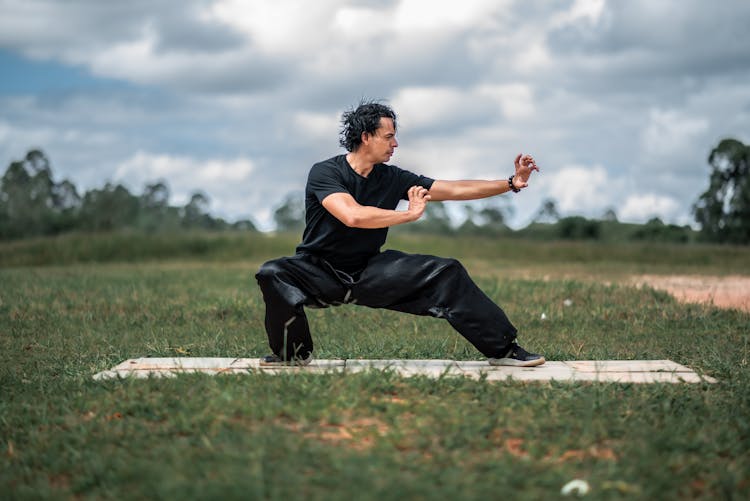 Man Practising Yoga Outdoors 