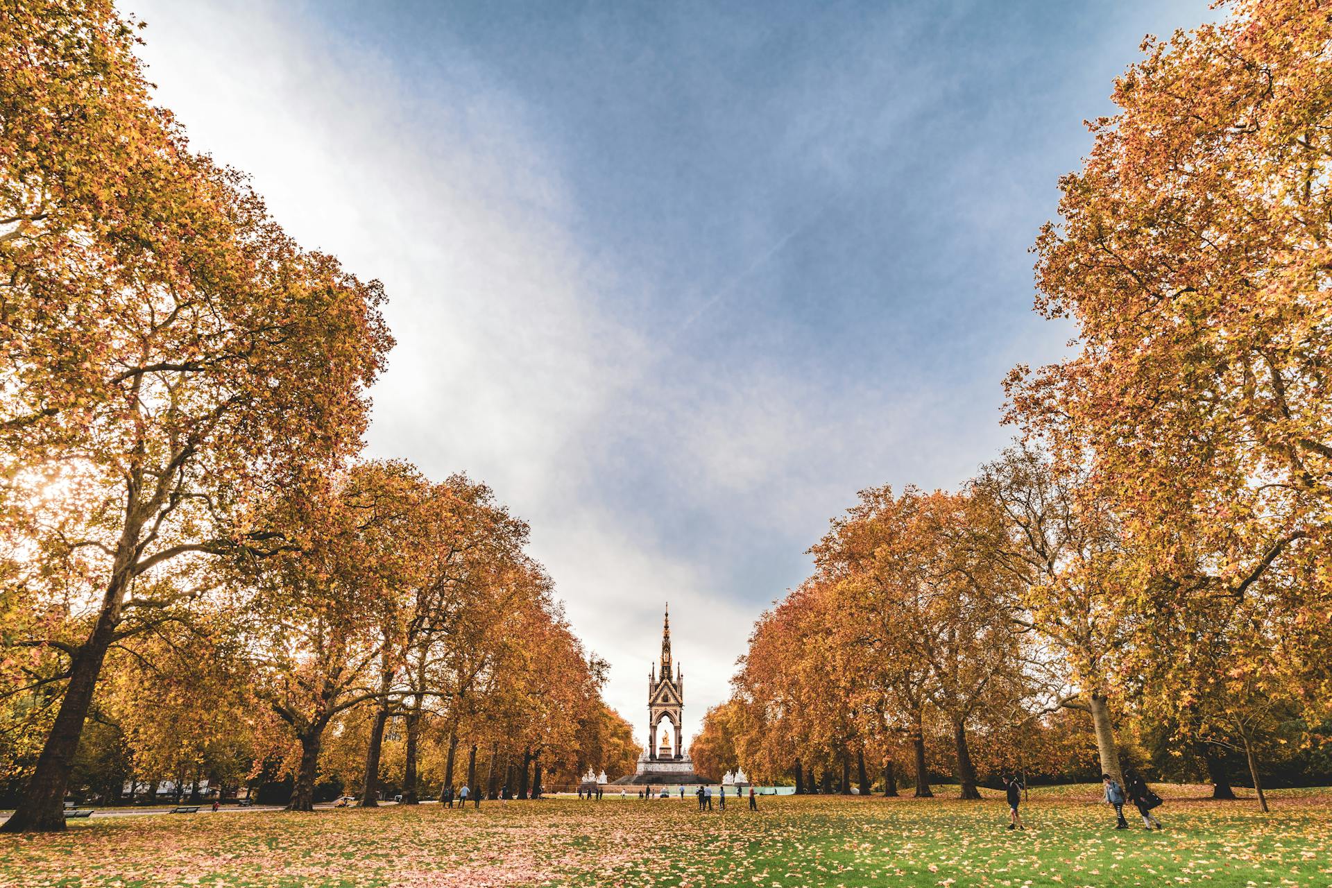 Picturesque view of the Albert Memorial with vibrant autumn foliage in London.