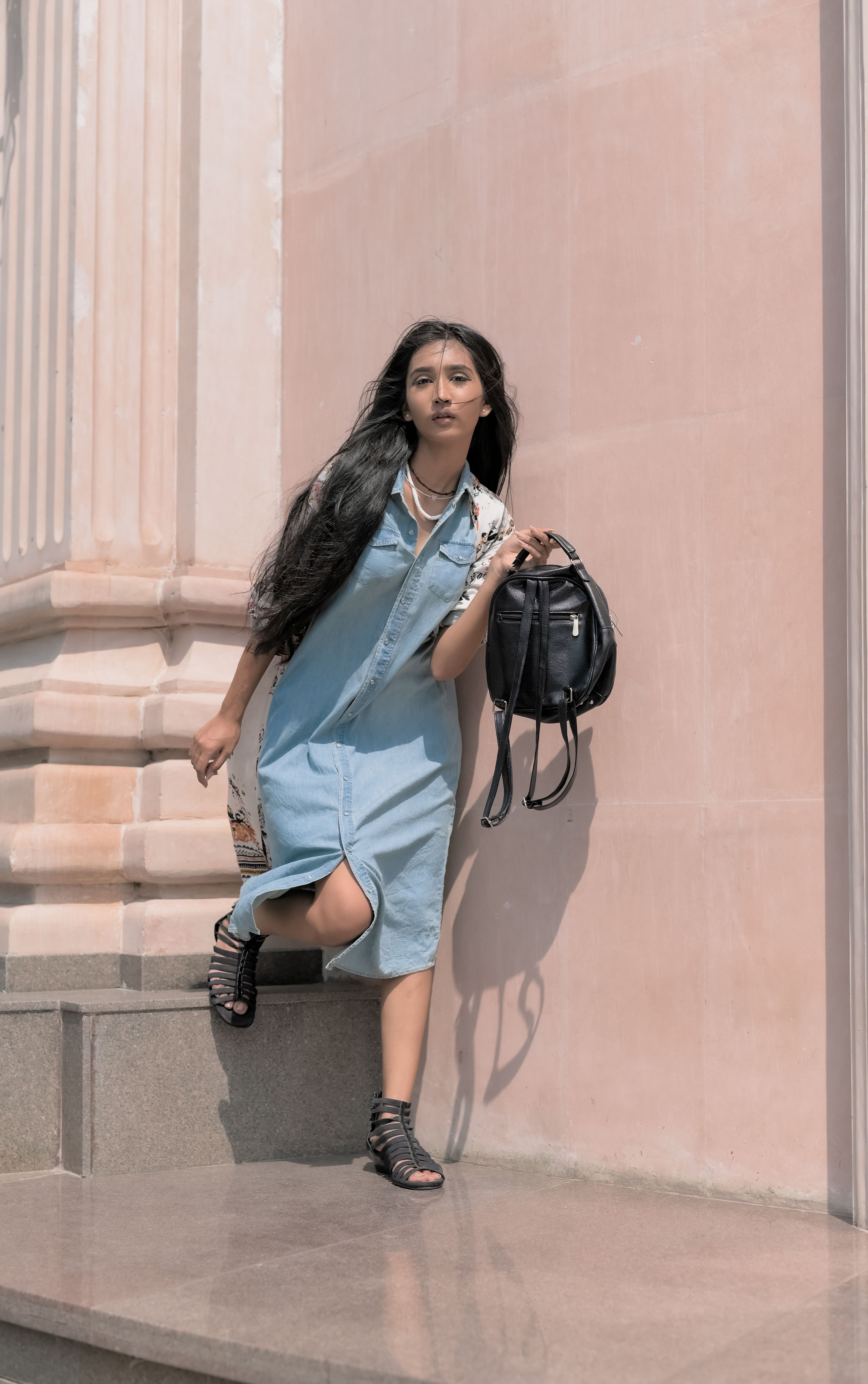 Young Pretty Girl in Blue Dress Posing at Building Wall · Free Stock Photo