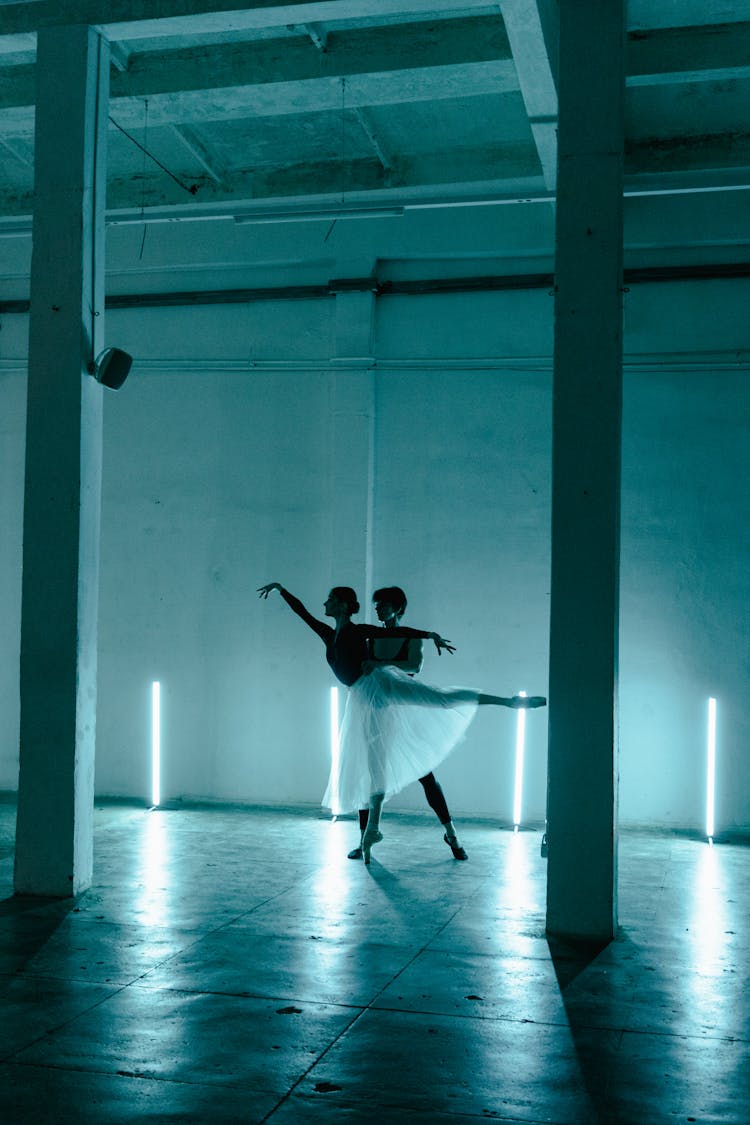 Silhouette Of Woman Dancing Ballet With A Man