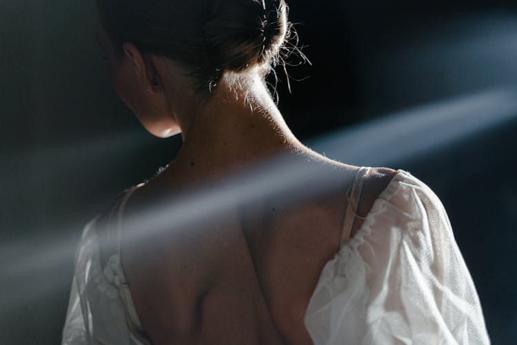 A Woman In White Off Shoulder Top