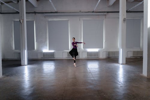 Free A Ballerina Dancing inside a Studio Stock Photo