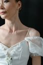 Woman in White Floral Spaghetti Strap Top