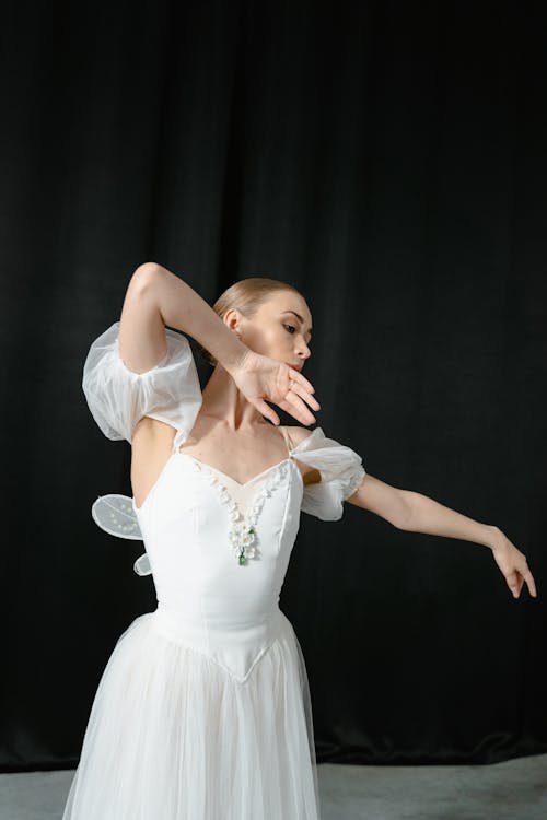 Woman in a White Dress Dancing