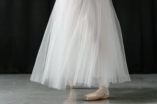 Ballerina in White Dress and Ballet Shoes