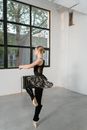 Woman in Black Tank Top and Black Leggings Doing Yoga