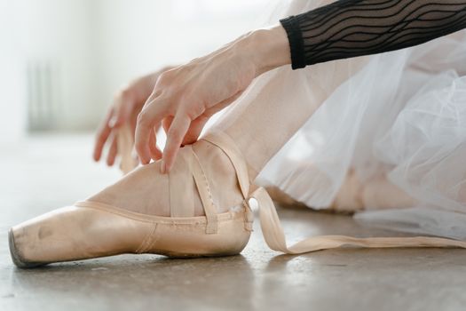 A Ballet Dancer Putting Ballet Shoes