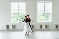 Dance duet rehearsing in a bright studio