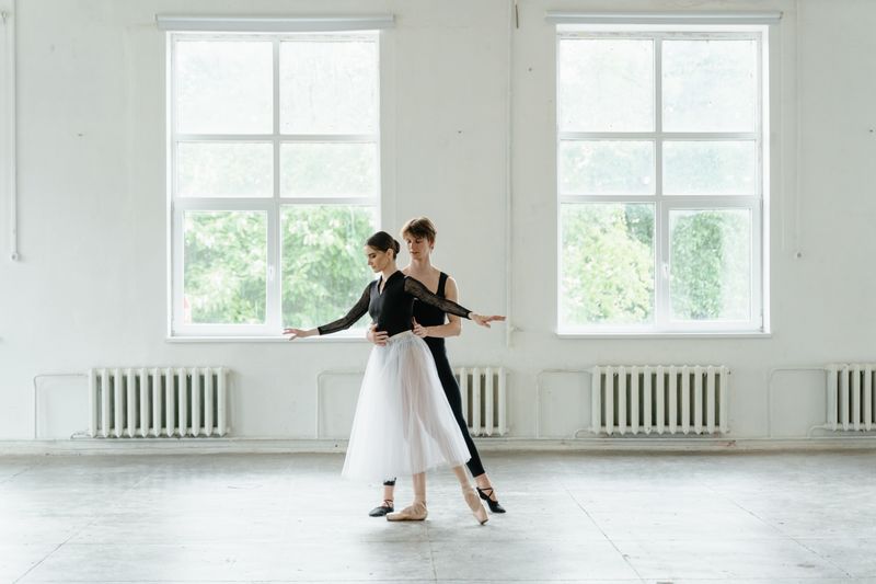 Dance duet rehearsing in a bright studio