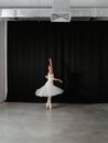 Woman in White Dress Dancing on Stage
