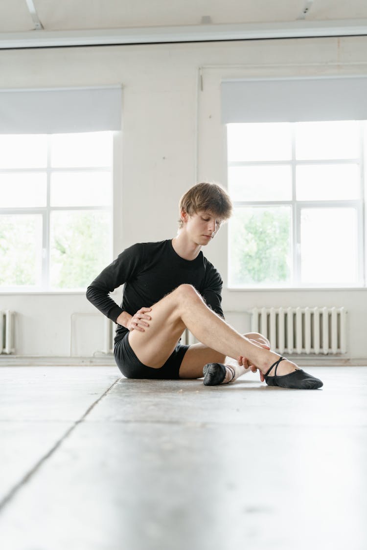 Man Massaging His Ankle