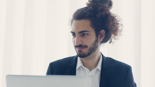 Portrait of an Elegant Man Working on Laptop 