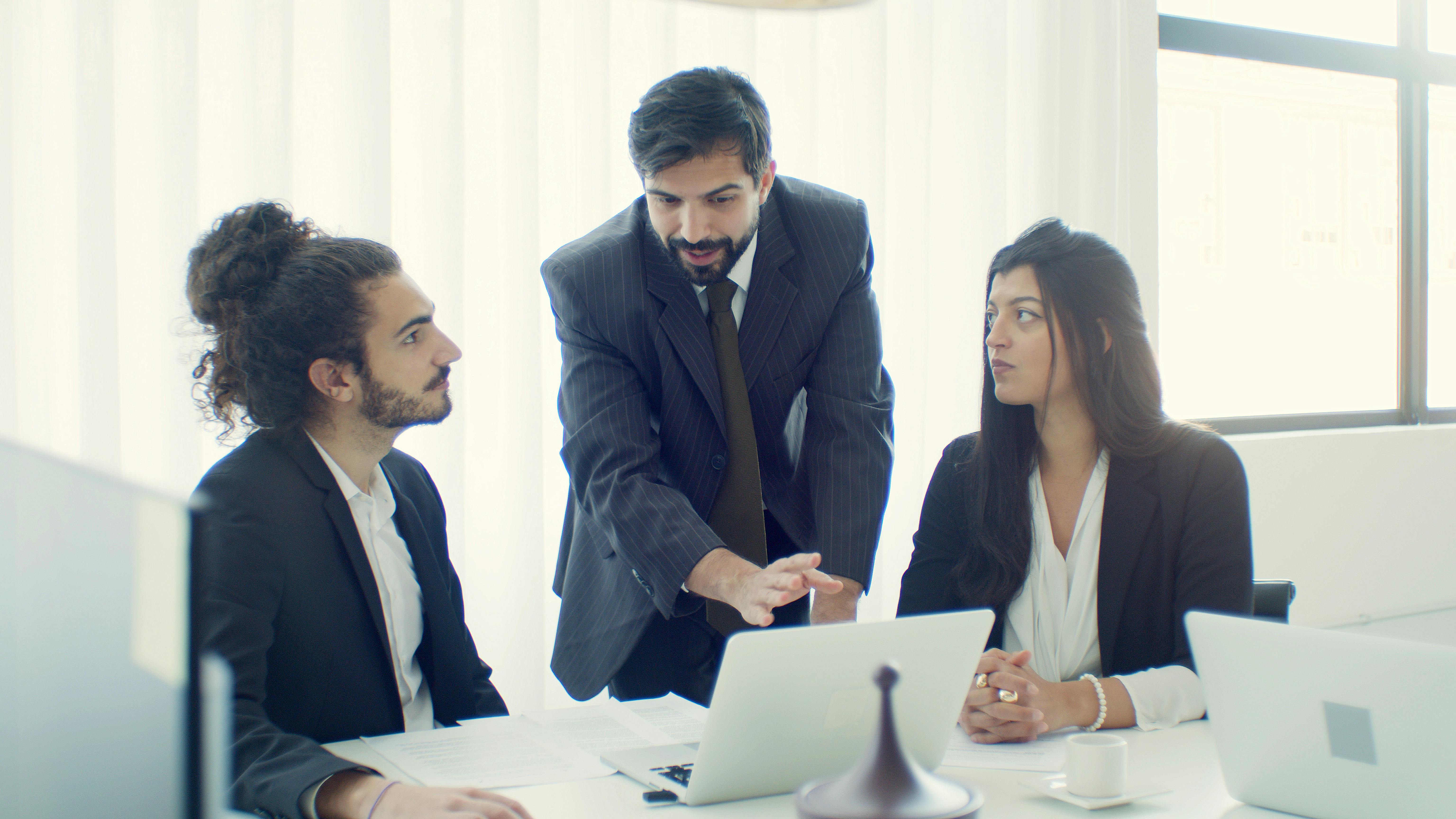 woman and men working together in office