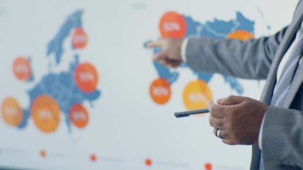 Professional presenting detailed analytics on European map during office meeting.