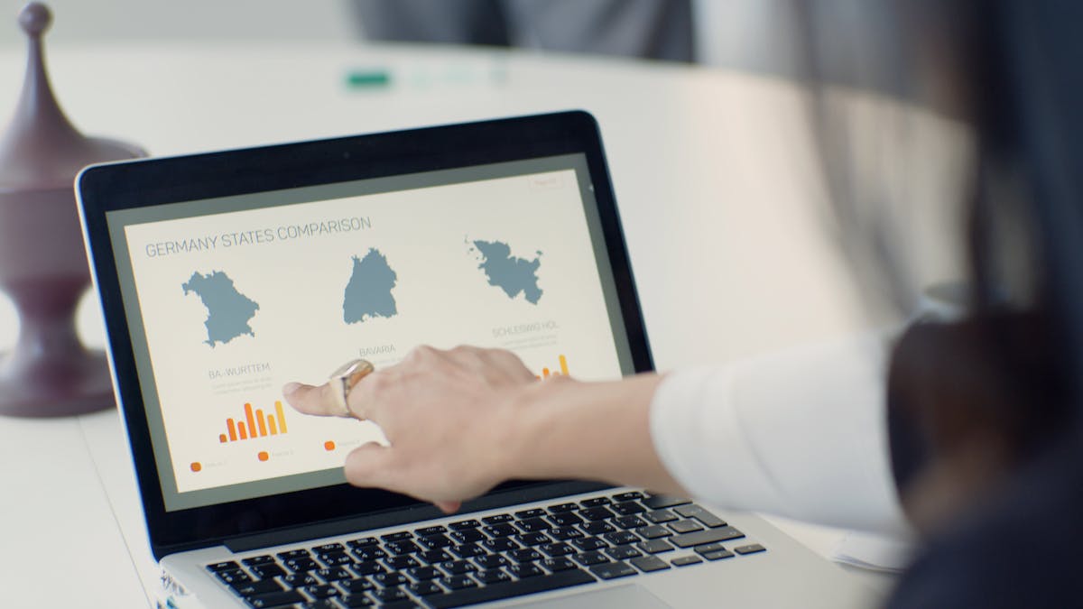 Professional reviewing local SEO and conversion data on a laptop