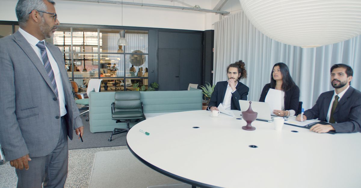 Professional business meeting with executives in a modern conference room