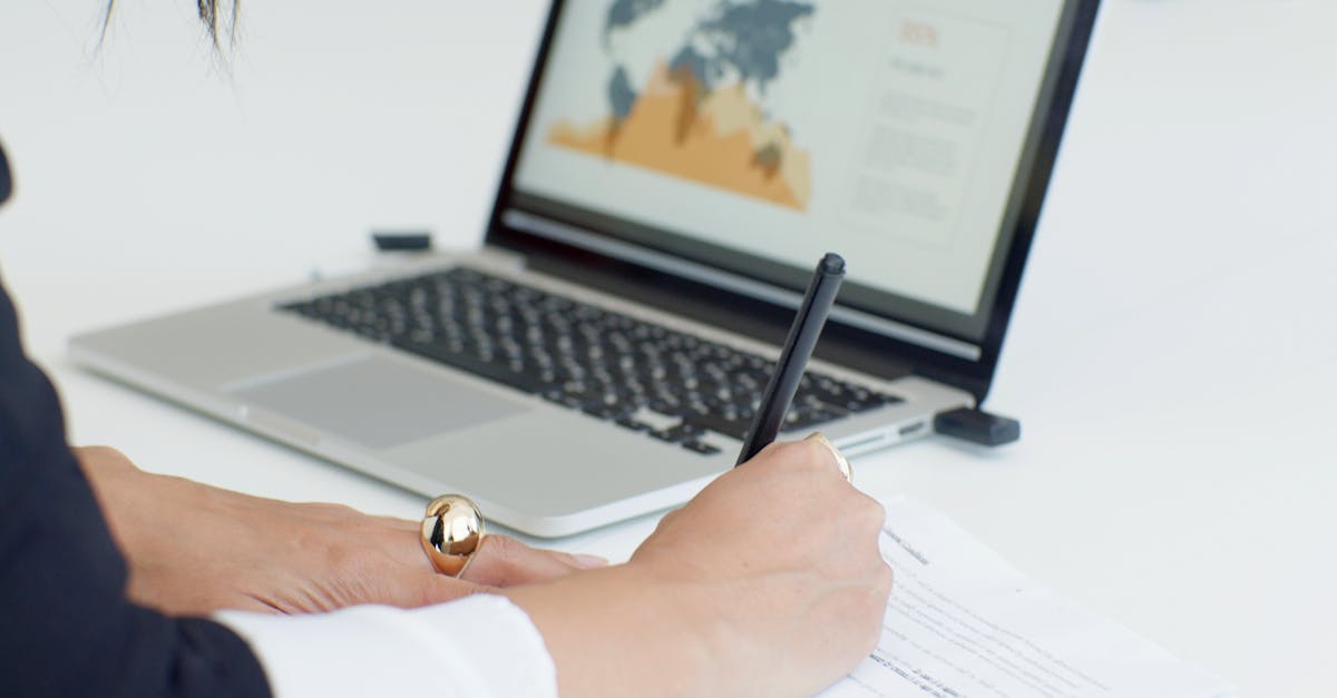 Person Writing on a Document · Free Stock Photo