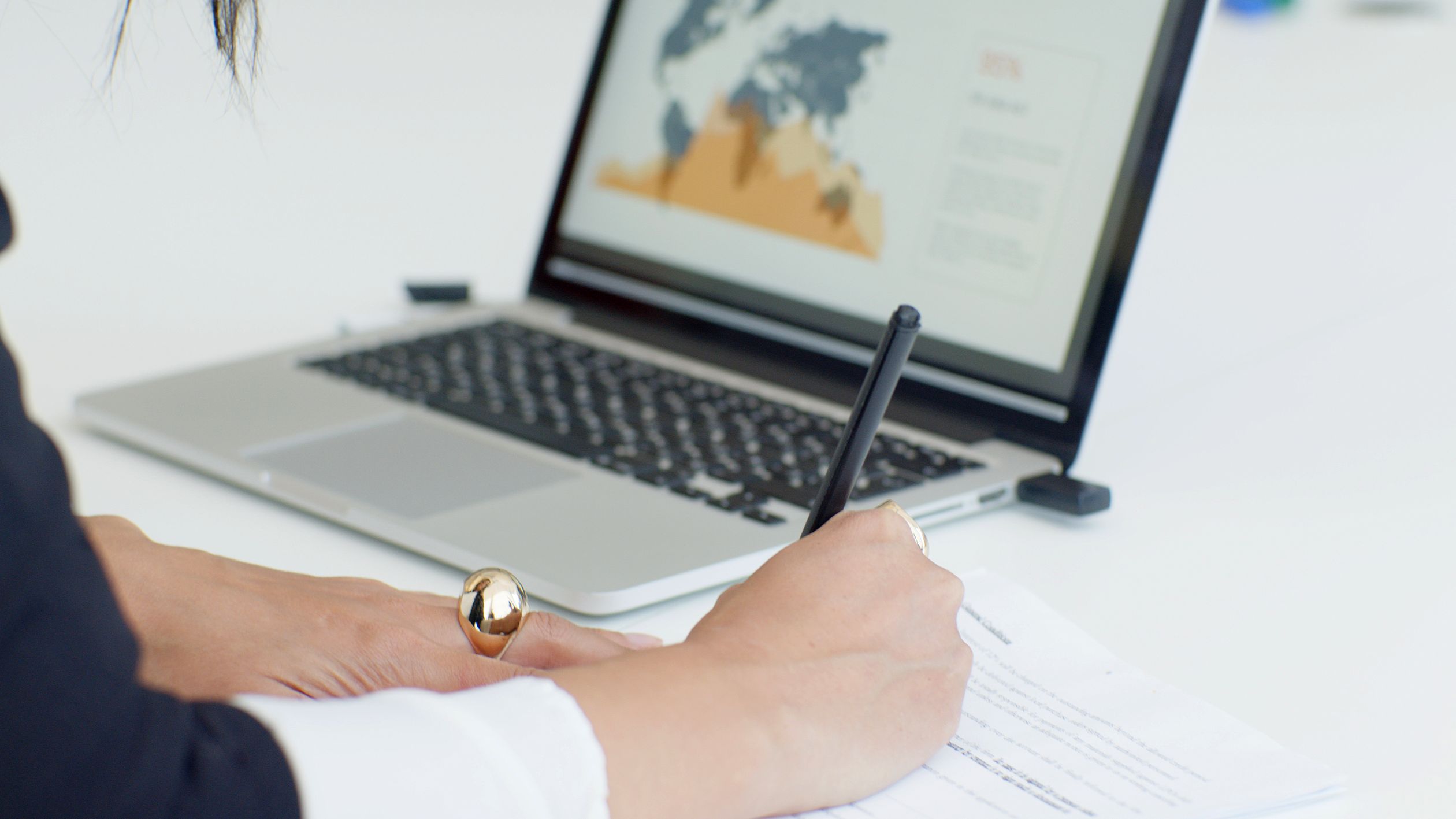 Person Writing on a Document · Free Stock Photo