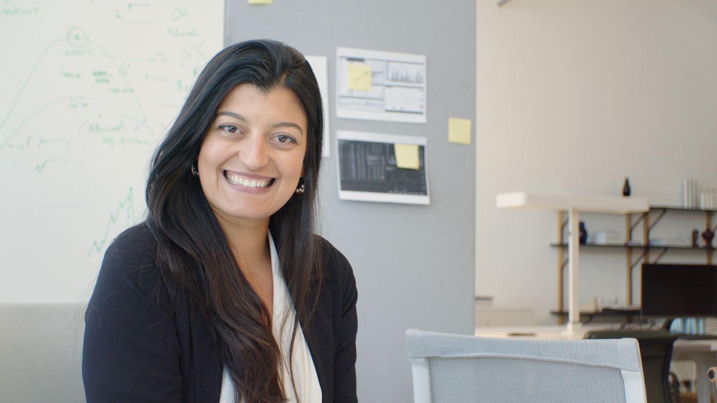 Professional smiling in an office. Stock photograph.