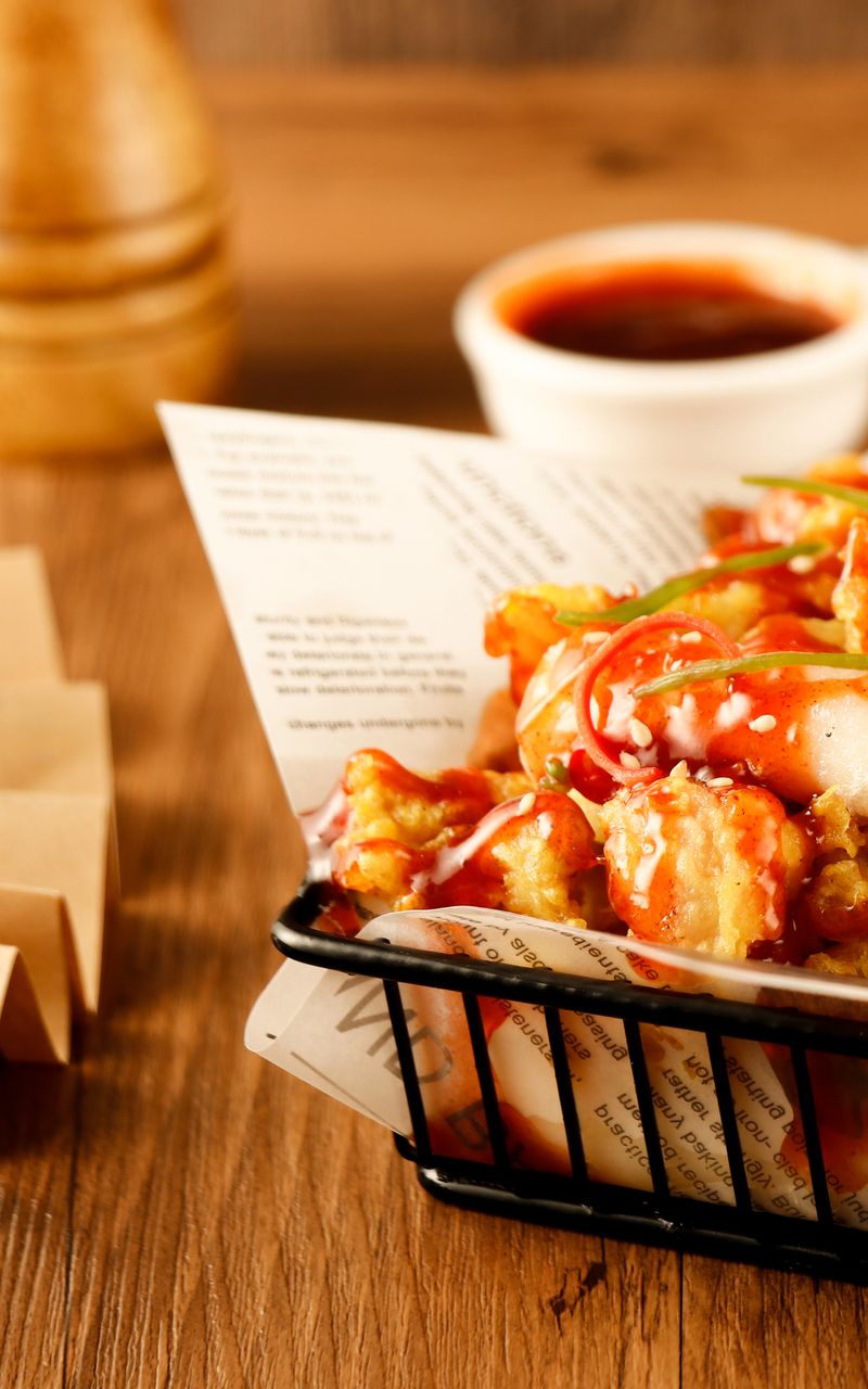 Illustrative small-plate fried chicken with dipping sauce; not the Moderne menu