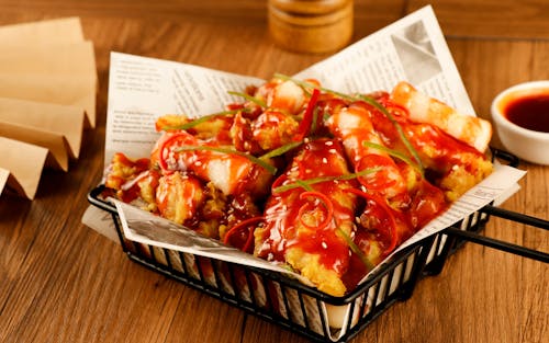 Deep Fried Food with Sauce Served in a Restaurant 