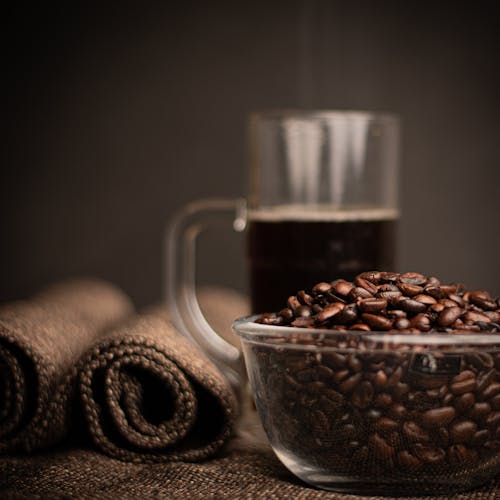 Close-up of Coffee Beans and Coffee on Table