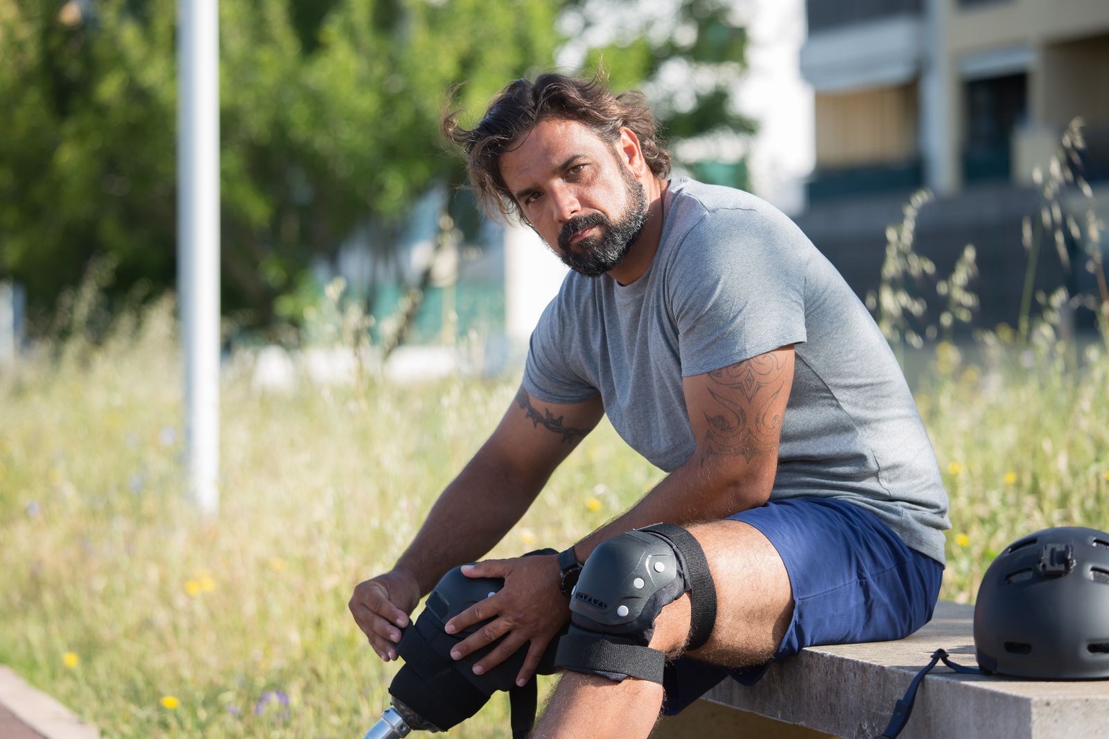 Person adjusting a knee brace before walking outdoors
