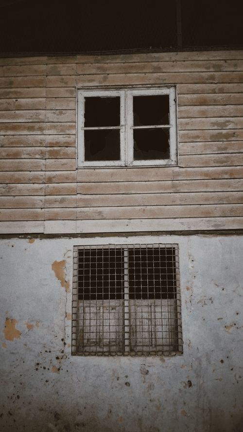 Free Weathered exterior of a rustic abandoned building in Kecamatan Cugenang, Indonesia. Stock Photo