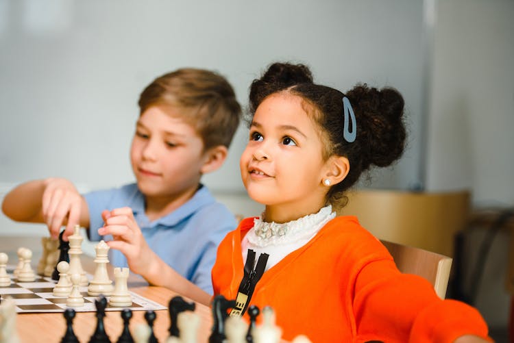 Boy And Girl On Chess Lesson