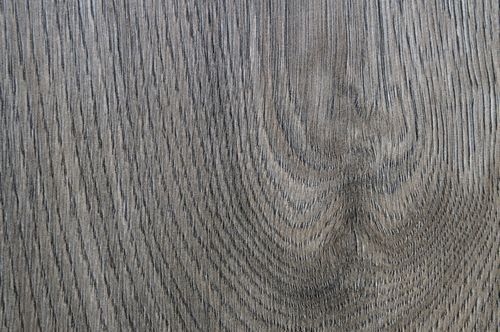 Free Close-up view of a natural wooden surface showing intricate grain patterns. Stock Photo