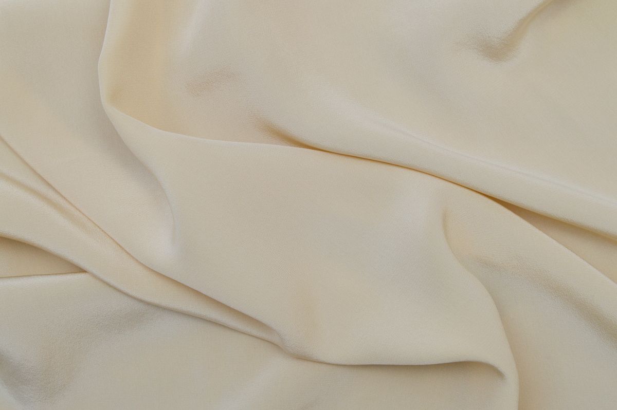 Close detail of undyed beige cloth, weave visible