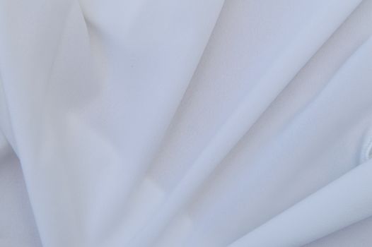 White Textile on Brown Wooden Table
