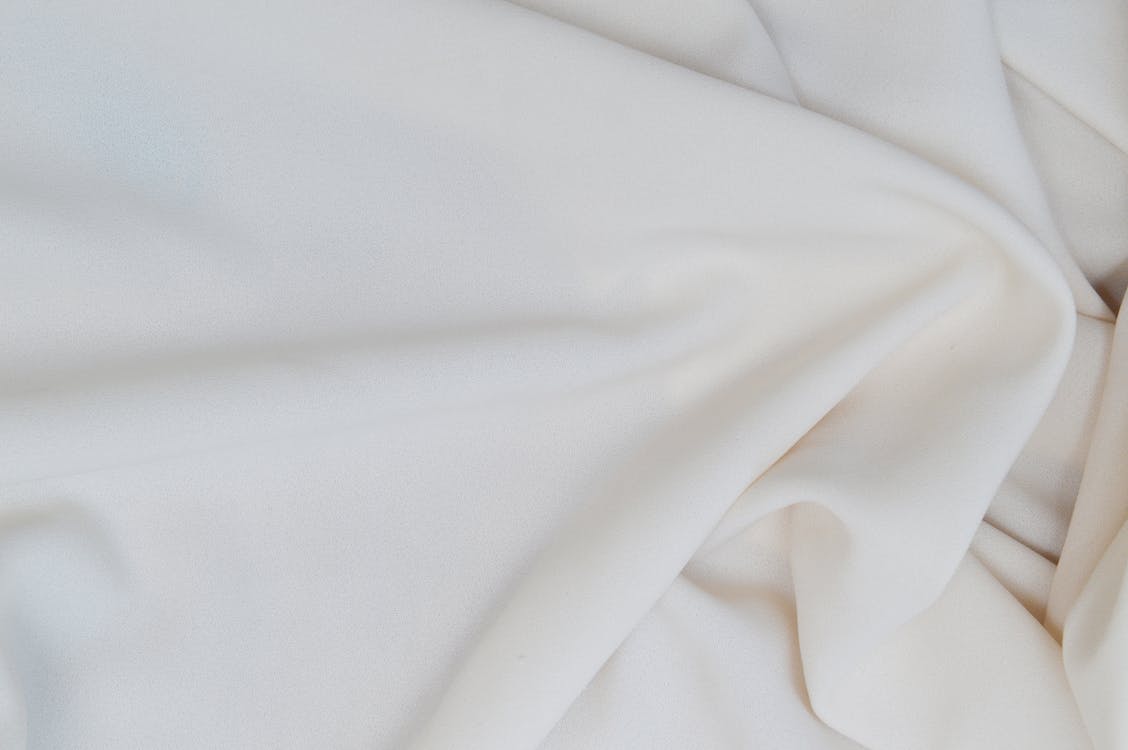 Close-Up Photo of a Smooth White Textile