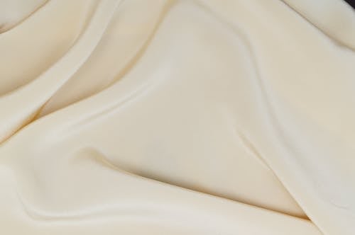 Free Close-Up Photo of a Smooth Cream Textile Stock Photo
