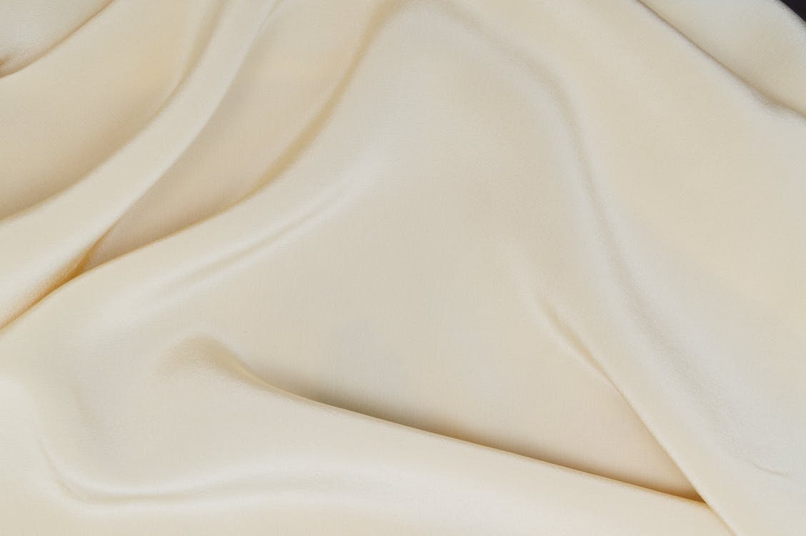 Close-Up Photo of a Smooth Cream Textile