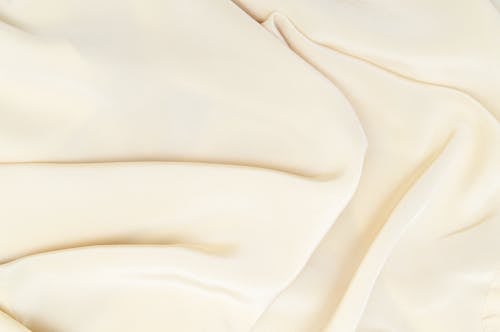 Close-Up Photo of a Smooth Cream Textile