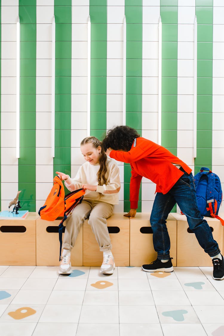 Boy And Girl Looking Inside The Bag