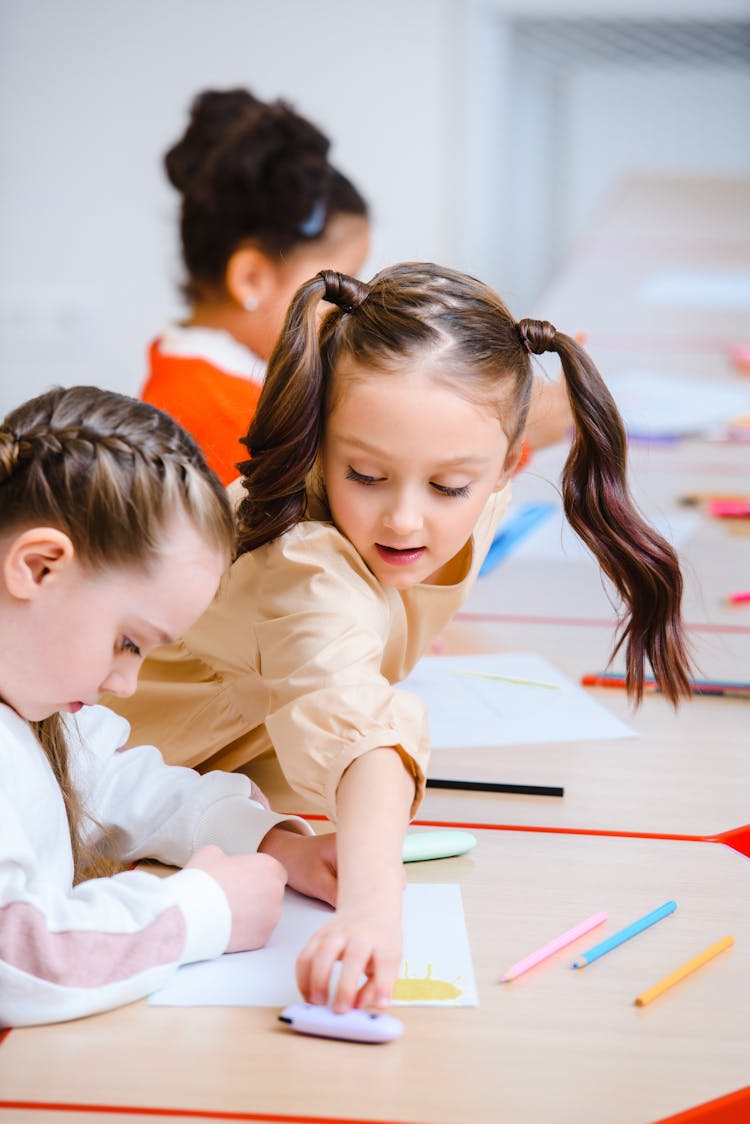 Two Girls Studying In The School