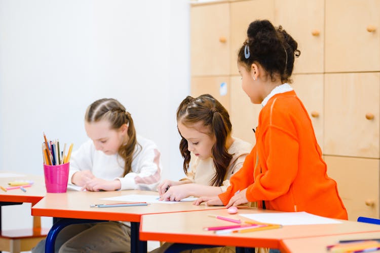 Young Girls Having An Activity Inside The Classroom