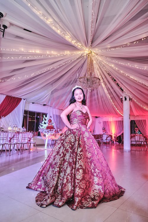 A Woman in Pink Floral Gown Smiling