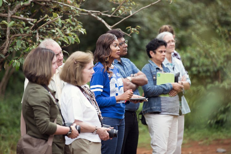 Tourists On Excursion In Forest